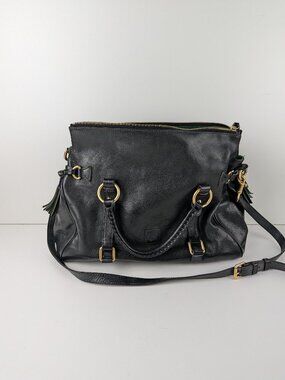 Dooney & Bourke Florentine Satchel Black Leather Hand Bag Purse With Tassels.